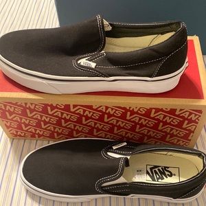 Black Vans classic slip ons